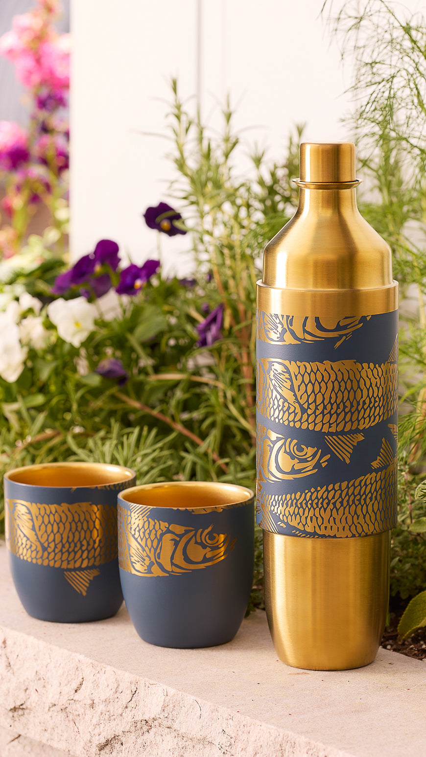 Caskata x High Camp wine Flask n Amalfi Blue (Dark Navy) with a Sardines pattern engraved in gold tones.