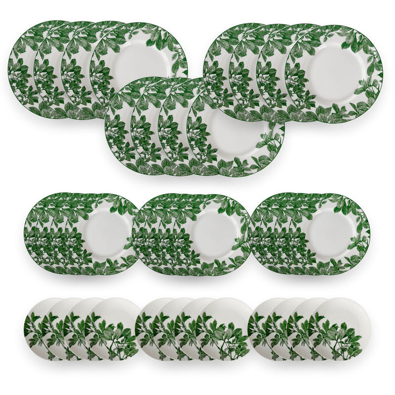 The Caskata Arbor Green Table for 12 is a porcelain dinnerware set with green botanical leaf patterns, including matching plates and serving platters; these floral dishes are dishwasher and microwave safe.