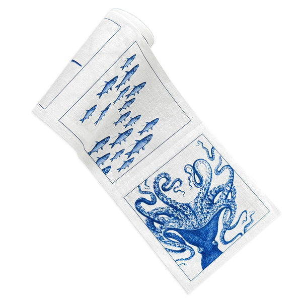 Caskata Coastal Cocktail Napkins on a roll, featuring best-selling patterns in blue and white on a cotton-linen blend that's reusable. These rolls come 50 napkins to a roll, featuring Lucy the Octopus, Horseshoe Crabs, School of Fish and Starfish patterns.