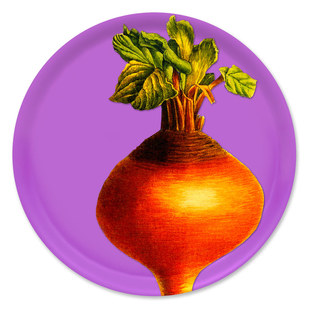 The Golden Beet Large Round Birchwood Tray by Caskata features a golden beetroot with green leaves on a purple background, blending farm-fresh vibes with sustainable elegance.