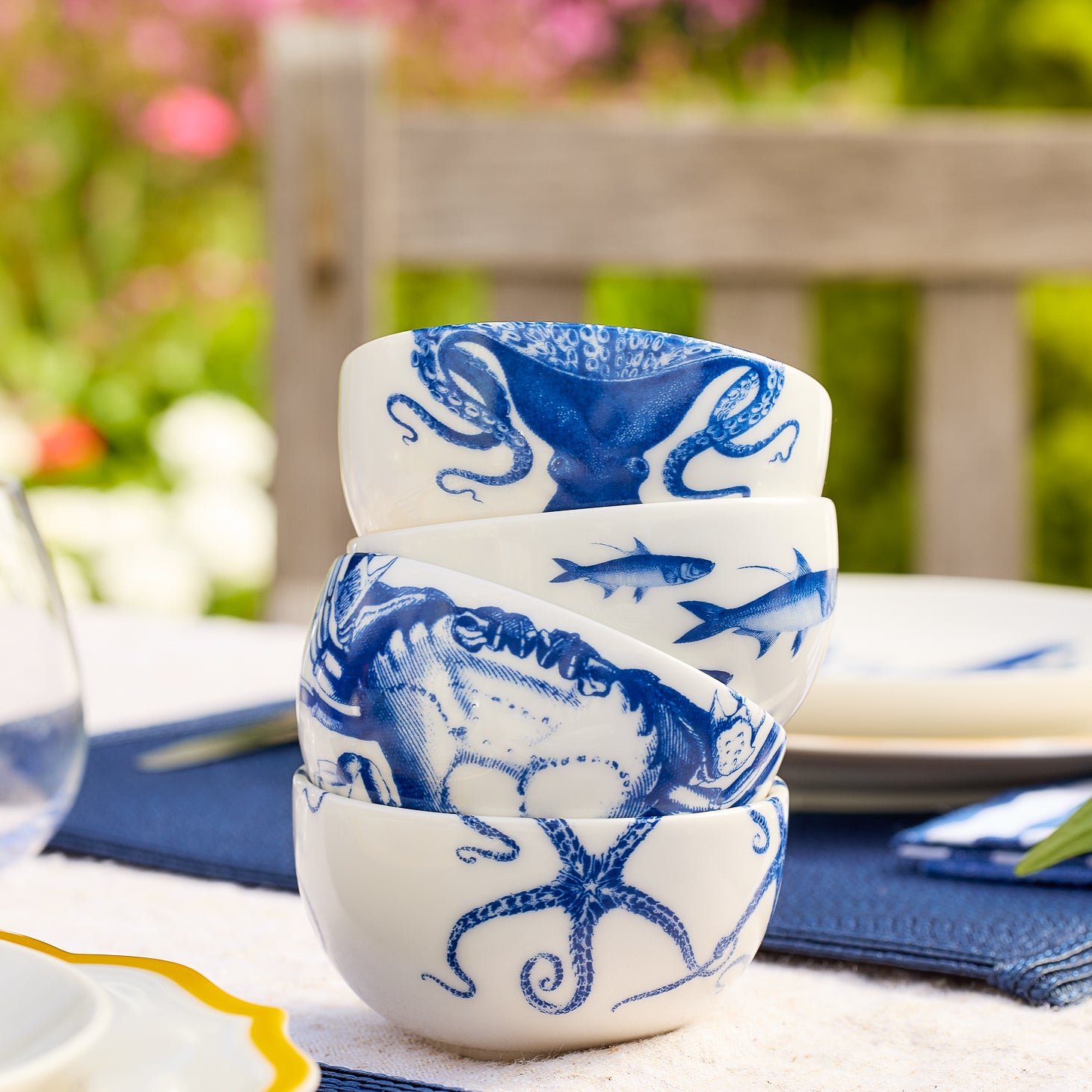 Mixed Set of 4 Small Porcelain Snack Bowls in iconic Coastal prints from Caskata including  Lucy the Octopus , crab, starfish, School of Fish patterns in blue.
