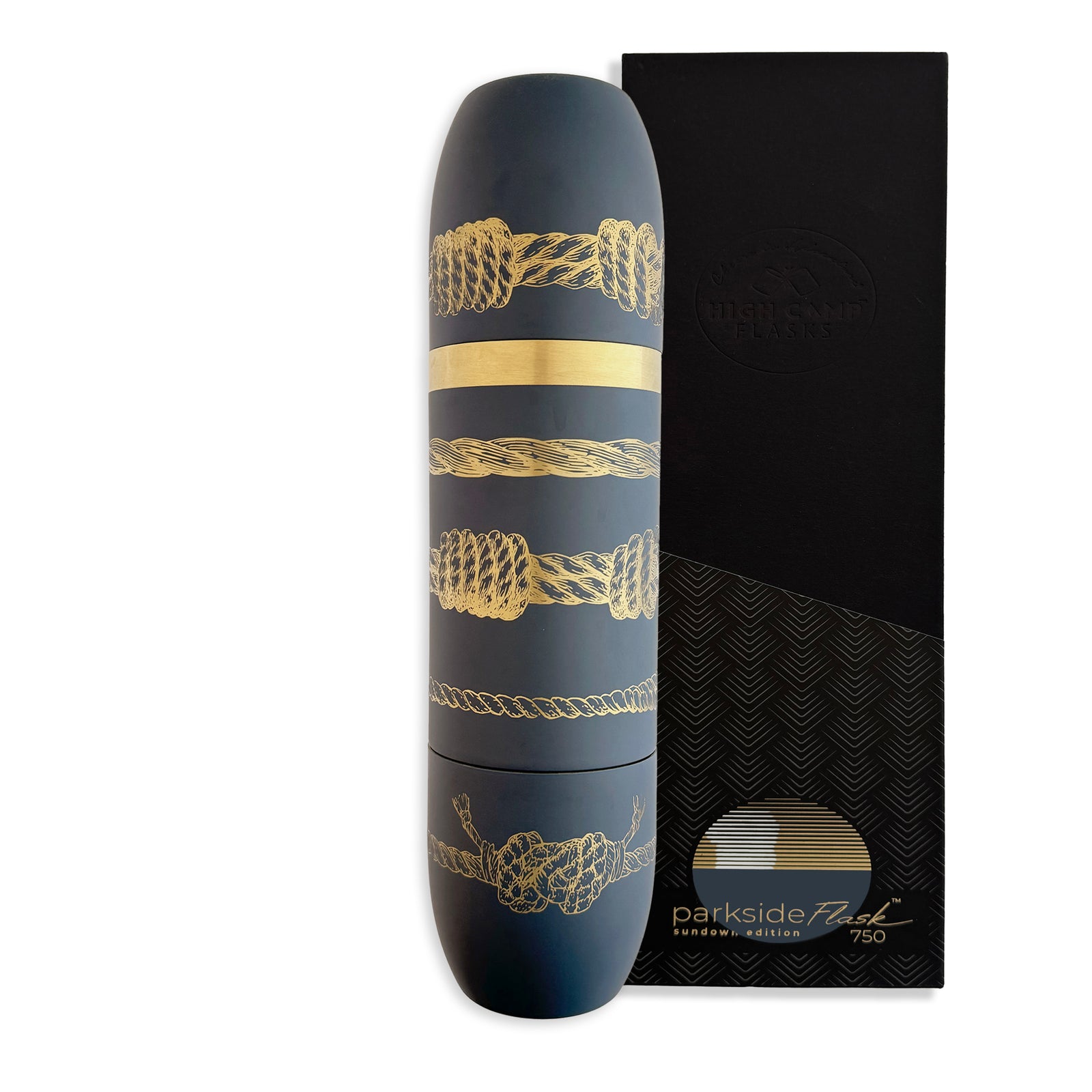 A dark blue Caskata x High Camp Sailors Knots Wine Flask featuring nautical rope patterns stands beside a textured black box labeled "parkside fuel limited edition 750.