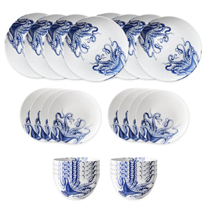 The Caskata Lucy Table for 8 is a premium porcelain dish set featuring white bowls, cups, and plates, each decorated with a charming blue octopus illustration.