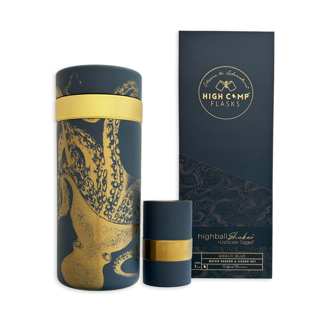 The Caskata x High Camp Blue Lucy Batch Cocktail Shaker by Caskata features a striking blue and gold octopus design and comes with packaging plus a matching vacuum-insulated cup—a must-have bar gadget for home mixologists.