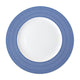 A white Newport Stripe Rimmed Dinner Plate by Caskata Artisanal Home with concentric blue circles around the edge, perfect for contemporary dinnerware collections.