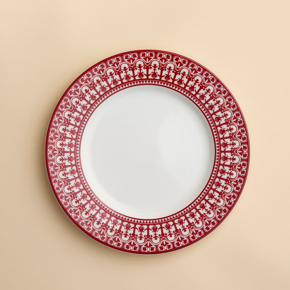 Casablanca pattern in Crimson Red from Caskata on this porcelain rimmed salad plate against a creamy beige background