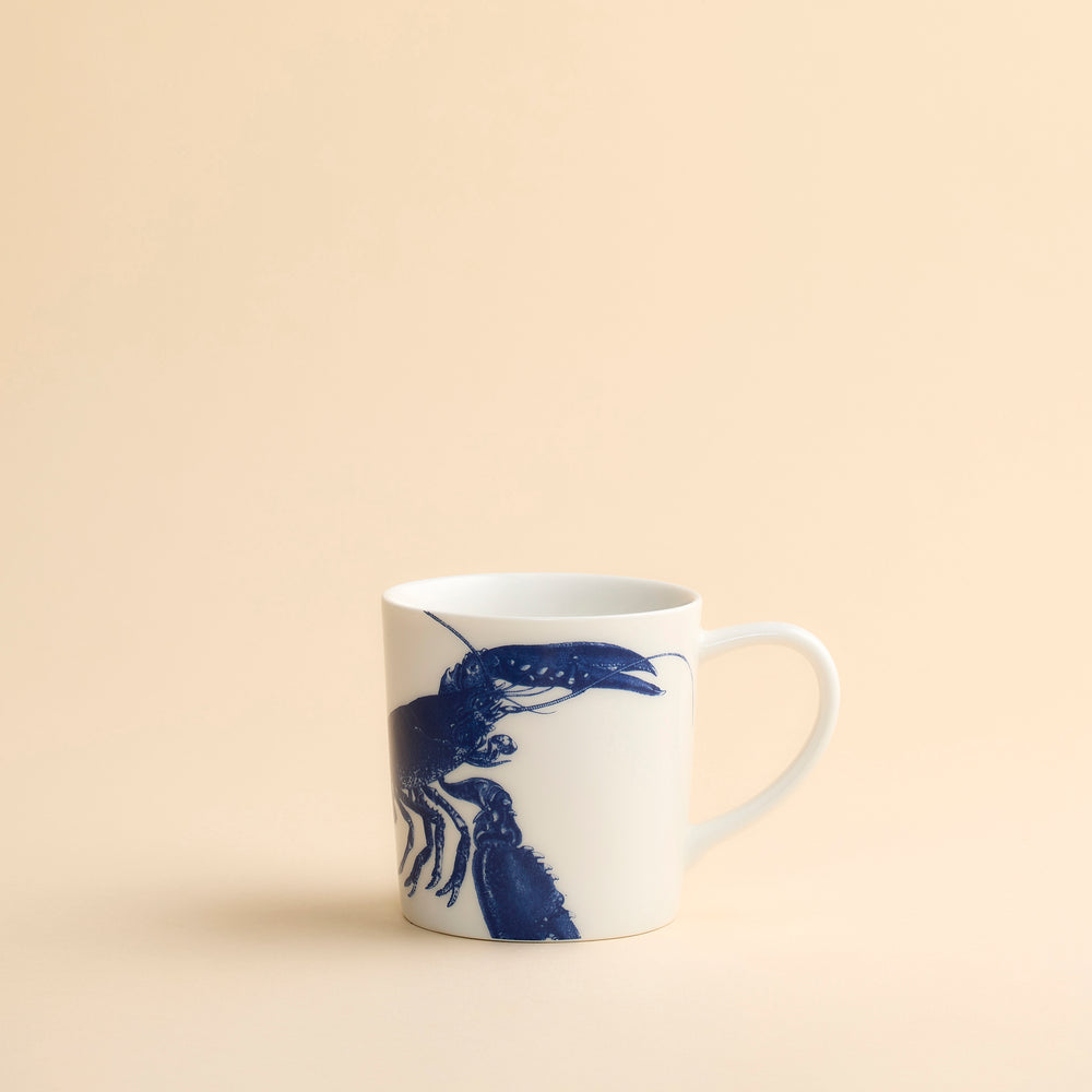 Classic and graphic this blue lobster wraps around this high-fired porcelain oversized mug from Caskata in their Blue Lobster pattern.