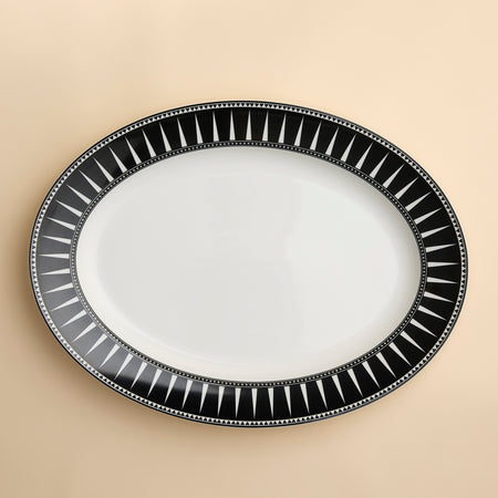 Marrakech large oval rimmed platter in a striking black and white geometric pattern on creamy porcelain from Caskata