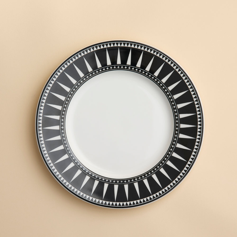 Marrakech pattern in bold geometric spikes around a rim of this porcelain salad plate from Caskata