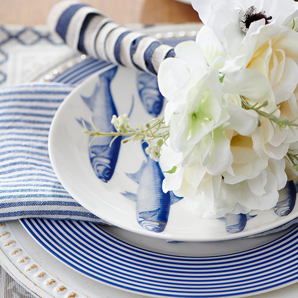 Bridal Bouquet Resting on a School of Fish Salad Plate on a Newport Dinner Plate from Caskata