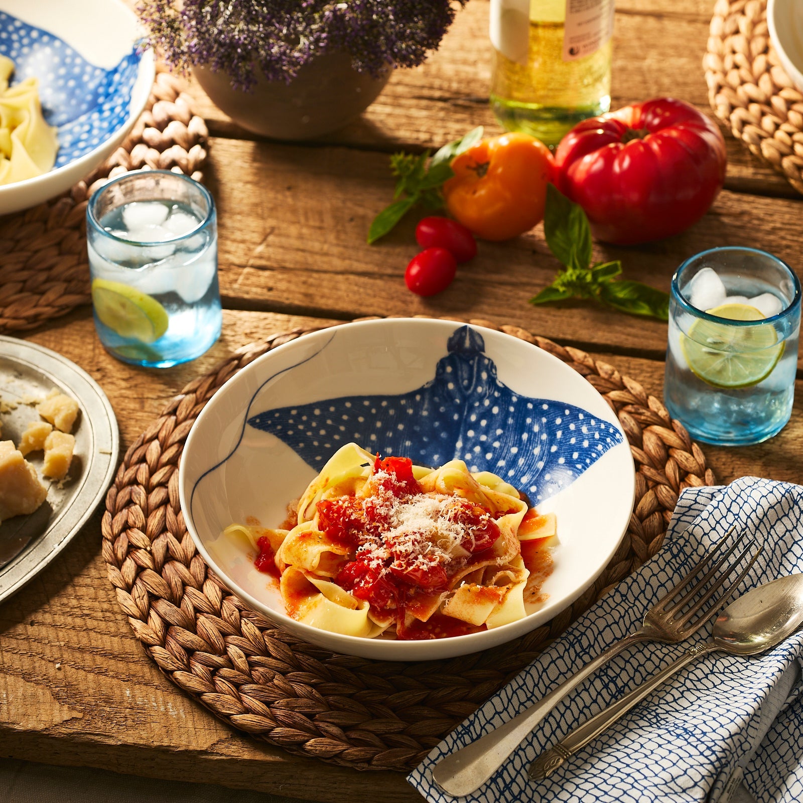 The Ray the Stingray Entrée Bowl by Caskata features playful blue stingray art on white porcelain, adding a whimsical touch to your tableware.